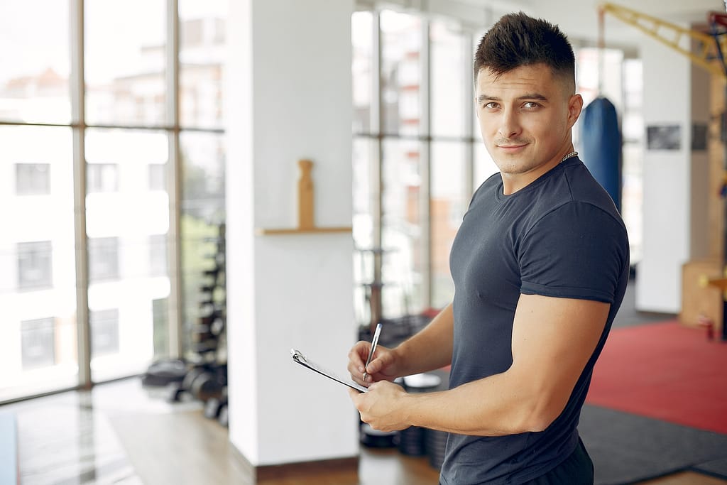 Focused and ready, this fitness professional embodies what it takes to become a personal trainer.