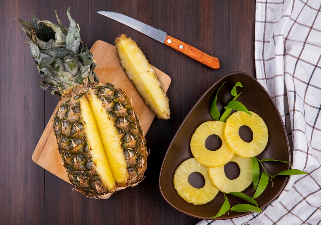 Fresh pineapple slices and whole fruit, perfect for Pineapple for Weight Loss plans.