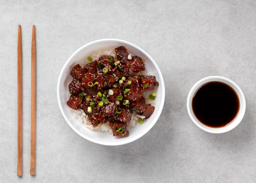 delicious-white-tuna-recipe-still-life-top-view_11zon Top view of a delicious teriyaki tuna bowl served with rice and green onions.